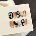Uñas postizas artesanales con ojo de gato ámbar, pan de oro y flores naranjas - Grande (L)