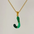 Macro shot of letter J pendant with green enamel segments on golden link chain - Green Gradient Enamel Letter J