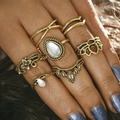 Close-up of gold gothic rings with teardrop gemstone and flower details on fingers - Lotus Geometric Gold Ring Set (RJ45055)