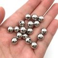 Polished silver metal round beads for jewelry making shown in hand for size context - White K Beads (14077)