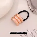 Rose gold wave metal charm on black elastic hair tie measuring 4cm by 3.2cm - Triple Layer Arc Rose Gold