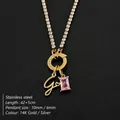 Stainless steel 14K gold plated initial G necklace with pink zircon and rhinestones. - Letter G