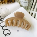 Detail view of a large milk tea colored flower hair claw on an artistic book page - Keel Style Claw / Approx 11cm / Deep Nude Pink