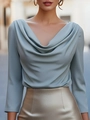 Close-up of elegant light blue satin long-sleeve blouse with stylish draped neckline - S / Tops / Light Blue