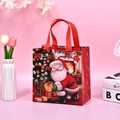 Christmas non-woven gift bag in red with Santa Claus and tree prints and handles - Red Santa Claus