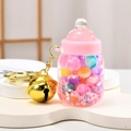 Pink milk bottle keychain with gold bell and star-shaped glitter charms inside - Bell Milk Bottle Style / Pink