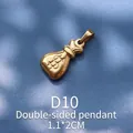 Close-up of a double-sided gold money bag pendant with dollar sign engraving - Gold Money Bag (D10)