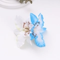 Close-up of double orchid hair clip with blue and white petals for beach vacation - Off-White + Blue