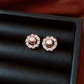 Macro view of 14k gold plated pearl flower earrings with white zirconia details - Champagne Pearl Halo Style (Silver Needle Gold Coffee)