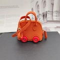 Mini car-shaped orange pebble leather charm bag with red wheels and gold zipper - Orange