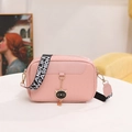 Pink woven camera bag for women with fashion strap and cat pendant crossbody style - Pink