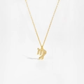Macro shot of gold S925 sterling silver Virgo zodiac pendant with white zircons - Virgo