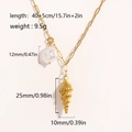 Collana in acciaio dorato con ciondolo a stella marina e perla con dettagli di misura - Conchiglia
