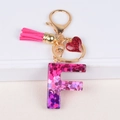 Sparkly letter F resin keychain with rose red tassel and glitter heart charm in gold - Letter F