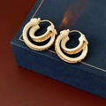Detail of double-layer C-shape earrings with gold texture and cream enamel on jewelry box - White (Real Gold Plated)