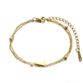 Golden double-layer stainless steel chain bracelet featuring a polished letter L pendant - L