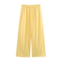 Detail of yellow loose-fit wide-leg trousers with elastic waistband and smooth fabric - S / Yellow Pants