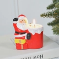 Santa Claus candle holder with red gift bag container and small burning candle - Gift Bag Santa Claus
