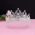 Macro shot of silver alloy bridal crown with intricate filigree and crystal detailing - No.7 Silver (White Stone)