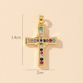 Detail of a gold plated cross pendant with multi-color zircons showing 3.4cm by 2cm size - Style U-Colorful Zirconia Cross (3.4cm)