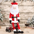 Santa Claus wine bottle cover in red velvet with plush beard on a vintage car decor - Long-legged Santa Style