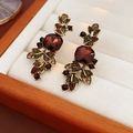 Close-up of vintage resin water drop earrings with red stones and green crystals - Vintage Ruby Flower Style (5#)