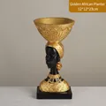Modern African statue resin sculpture in black and gold holding a large bowl tray - 8698 Gold African Woman Carrying Basin on Head