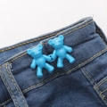 Bright blue bear-shaped waist adjuster buckle installed on dark blue denim jeans - Screw Back Large / Rhine Blue