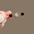 Golden geometric brooch with black and clear crystals shown on a luxury coat - 324# Black & White Grid