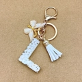 Chic resin letter L keychain with white tassel and golden butterfly charm for bags - Letter L