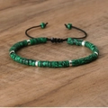 Adjustable woven bracelet with green emperior stone beads and silver spacers on wood - No.35 Malachite Green
