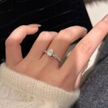 Elegant twisted band moissanite ring with oval center stone worn by a model - Ice Flower Cutting [adjustable Opening] Ljz-174 / Adjustable Open