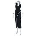 Detail view of the deep U-neckline and white lace trim on a slim black slit dress - S / Black
