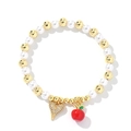 Golden beads and pearls bracelet with zircon heart and red apple charm pendants - Red Apple Style
