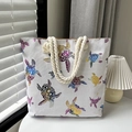 White canvas tote bag featuring colorful sea turtle print and natural rope handles - Multi-color Turtle
