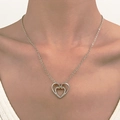 Elegant silver double heart pendant necklace with sparkling white rhinestones on model - Silver Double Heart Rhinestone (K-1223)