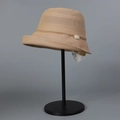 Detail of light brown straw sun hat with delicate pearl beaded trim on display stand - M(56-58cm) / Khaki