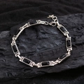 Bracciale in argento con gemme nere rettangolari e cristalli su carbonella - Nero