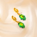Golden hoop earrings with green Hamsa palm pendants on beige silk background - Palm Pendant Style (0500)