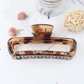 Glossy amber leopard print square hair claw clip made of durable resin on neutral background - Leopard Yellow