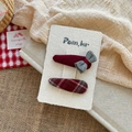 Detail of red bow hair clip and plaid fabric clip set on textured display card - Water Drop Bowknot + Water Drop Plaid