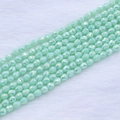Macro detail of faceted mint green strawberry drop beads for DIY jewelry making - 4*5mm (Approx 95pcs/strand) / Mint AB