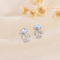 S925 moonstone astronaut earrings in silver with gold star on soft knit background - Astronaut Style