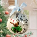 Memorial Christmas ball with red cardinal, white ribbon and wing charms hanging on tree - With You Red Bird + Wings