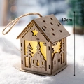 Luminous 10cm wooden Christmas house pendant with warm LED light and star cutouts - Large Cabin Church