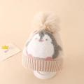 Close-up of knit texture and plush pompom on a penguin pattern winter hat for kids - Approx. 3-8 Years / Khaki