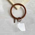 Brown silicone phone ring wrist strap with silver spring buckle and clear spacer tab - Brown