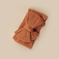Ribbed knit baby headband with a large double bow in vintage rust red color - Orange Red
