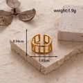 Adjustable gold titanium steel ring with geometric hollow fence frame design - Geometric Fence / Gold