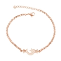 Detail of rose gold star and moon pendant bracelet with adjustable extension chain - Moon & Star / Rose Gold